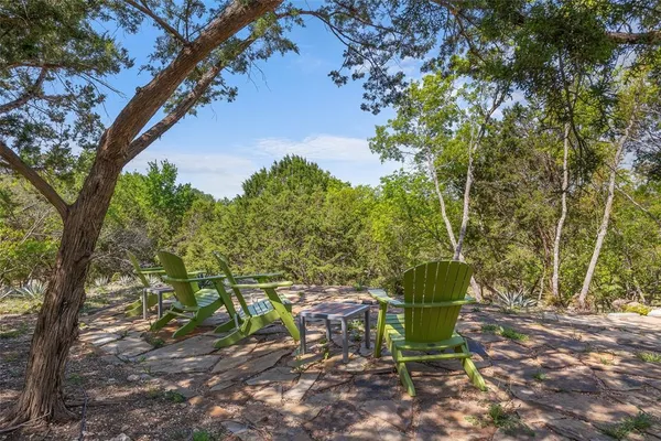 a view of a table and chairs in the garden