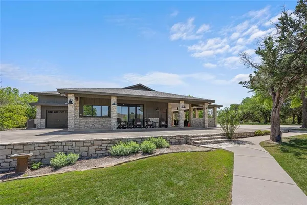 a front view of house with yard and green space