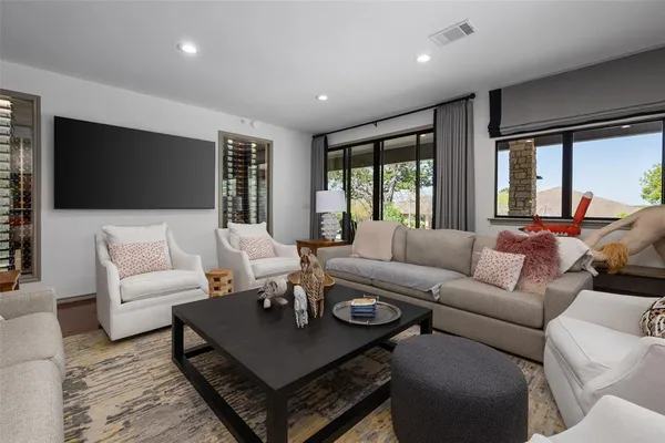 a living room with furniture and a flat screen tv
