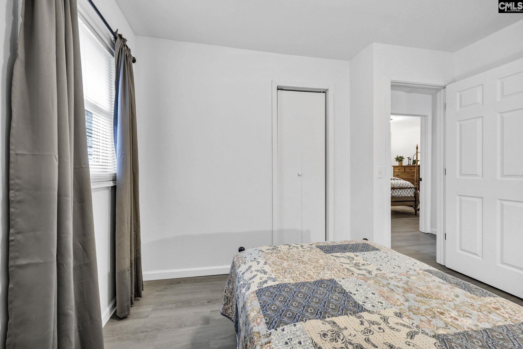 8107 Black River Road Rembert, SC 29128 - Photo 24 of 38 a bedroom with a bed and a window