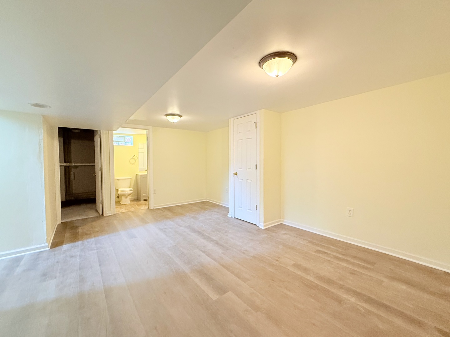 17511 Maple Avenue Lansing, IL 60438 - Photo 15 of 24 a view of an empty room with wooden floor and a window