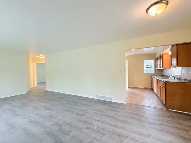 a view of a kitchen and a window