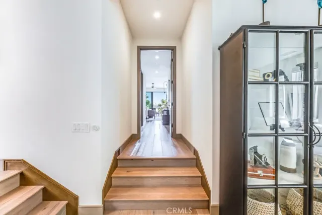 a view of staircase with white walls and windows
