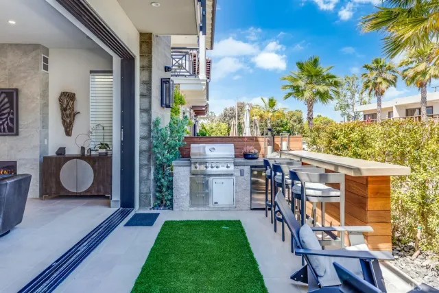 a view of an house with backyard space and balcony