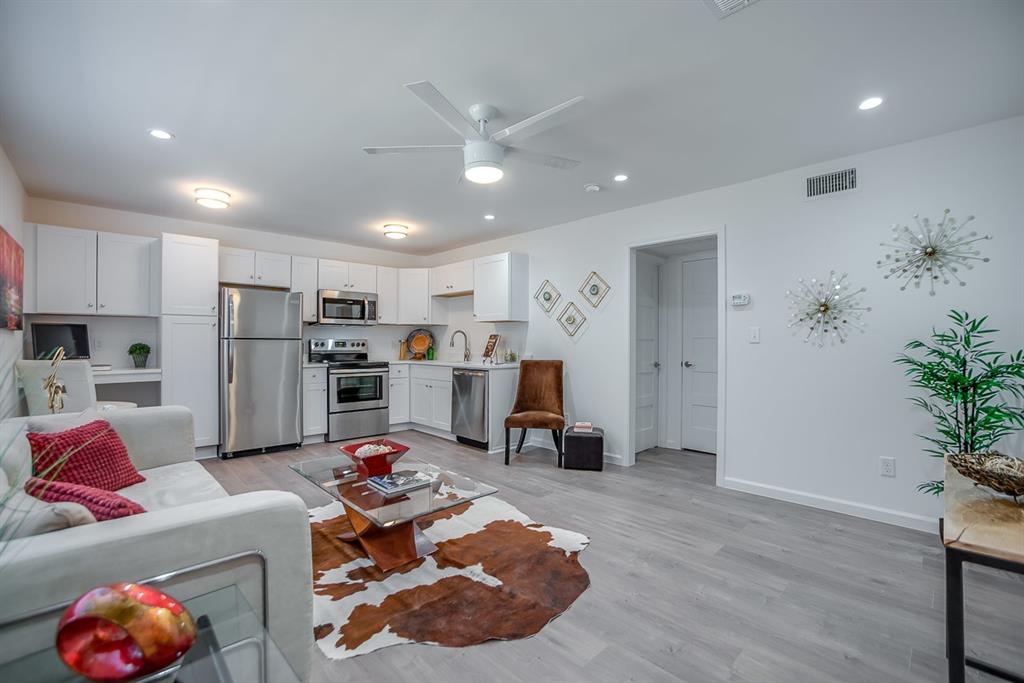 1809 Bennett Avenue, Unit 211 Dallas, TX 75206 - Photo 2 of 5 Living room featuring sink, light hardwood / wood-style floors, and ceiling fan