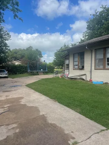 a view of a backyard of the house