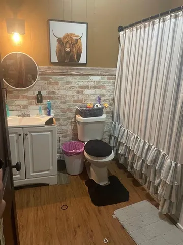 a bathroom with a toilet and a sink