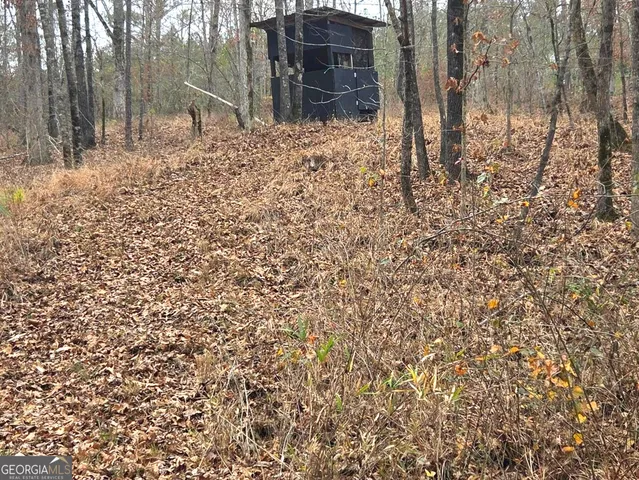 a view of a lake in between the two and trees