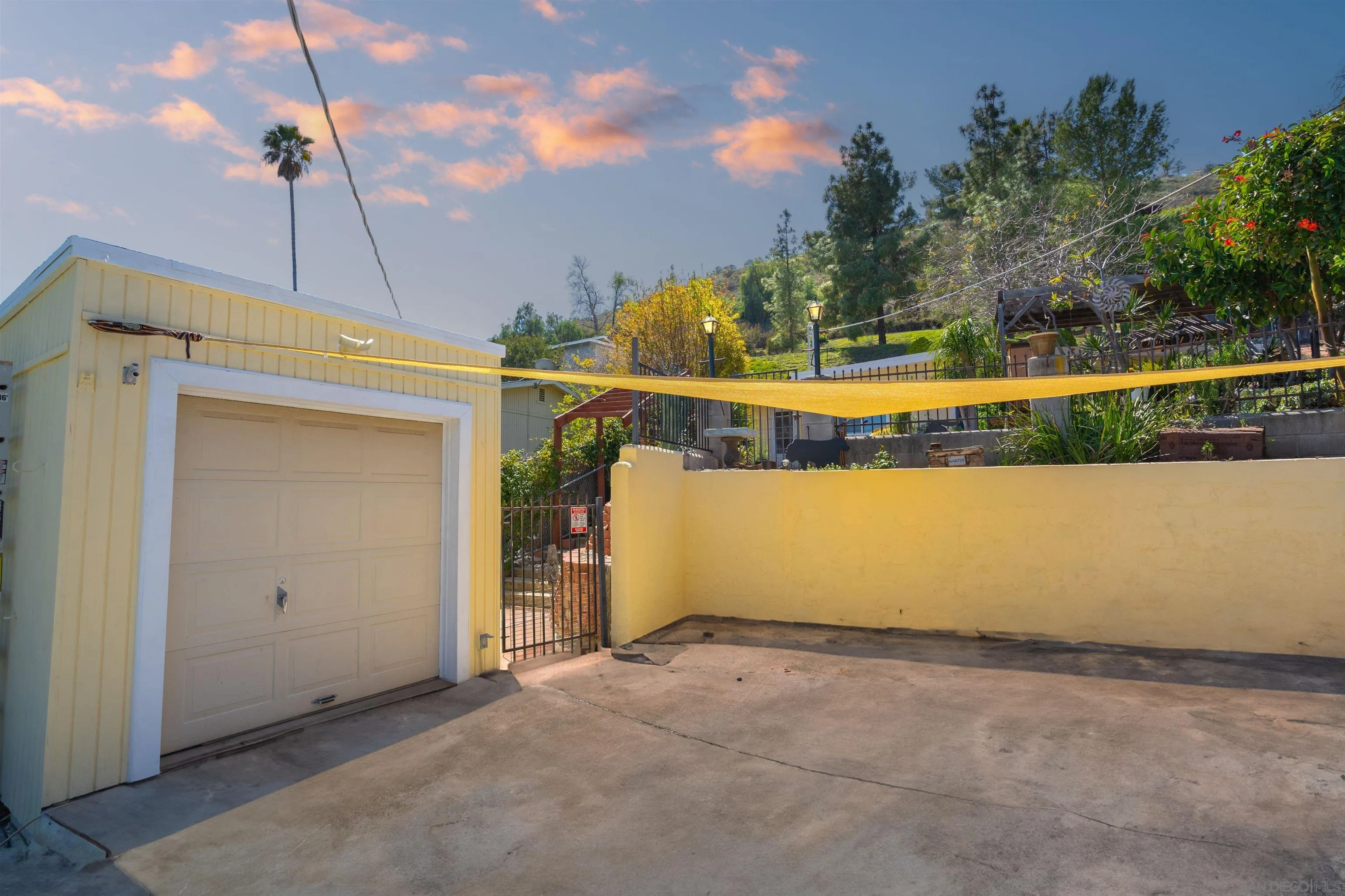 8726 Golden Ridge Road Lakeside, CA 92040 - Photo 21 of 23 an outdoor view of a house with a swimming pool