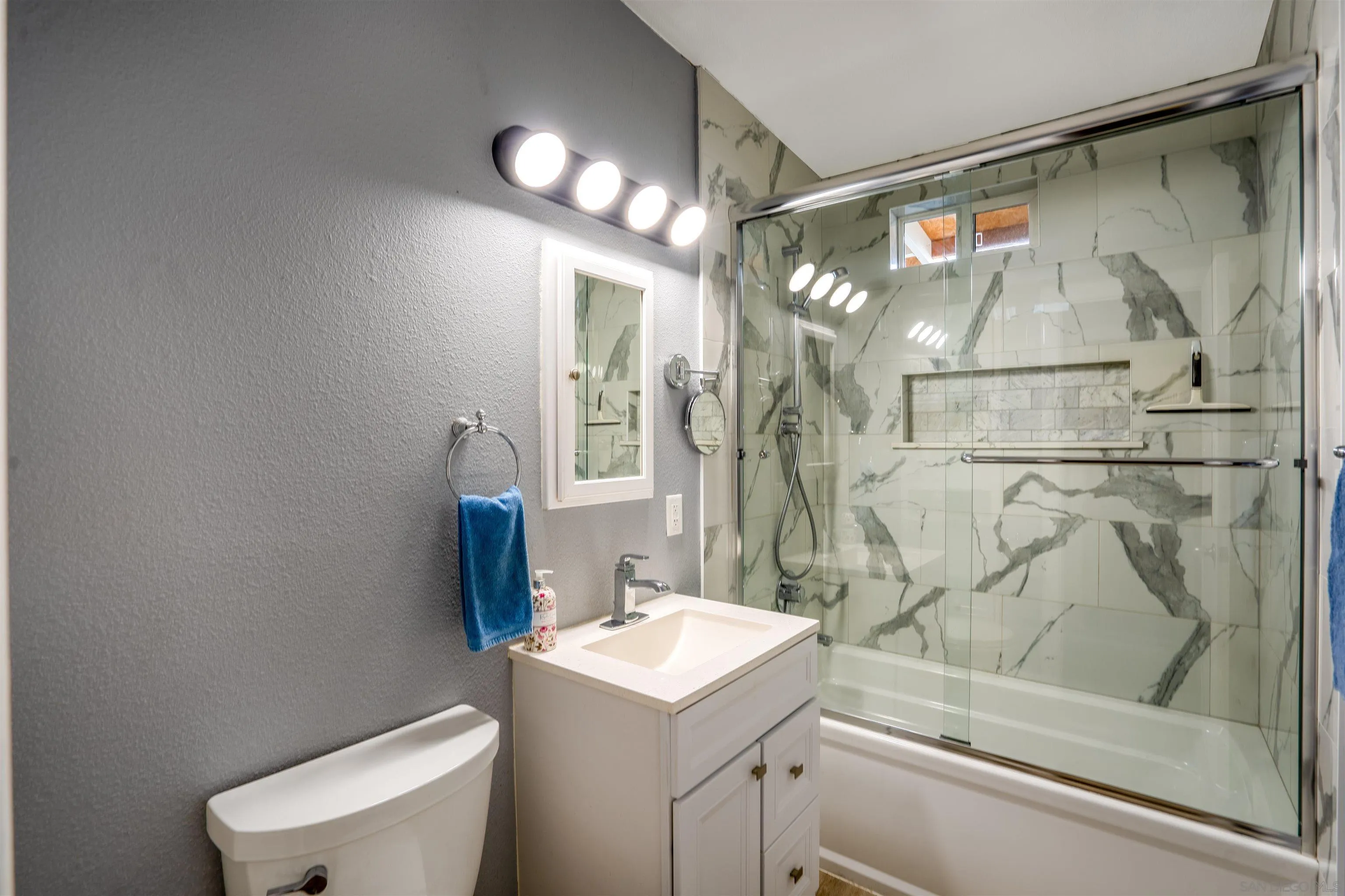 8726 Golden Ridge Road Lakeside, CA 92040 - Photo 9 of 23 a bathroom with a sink a toilet and shower