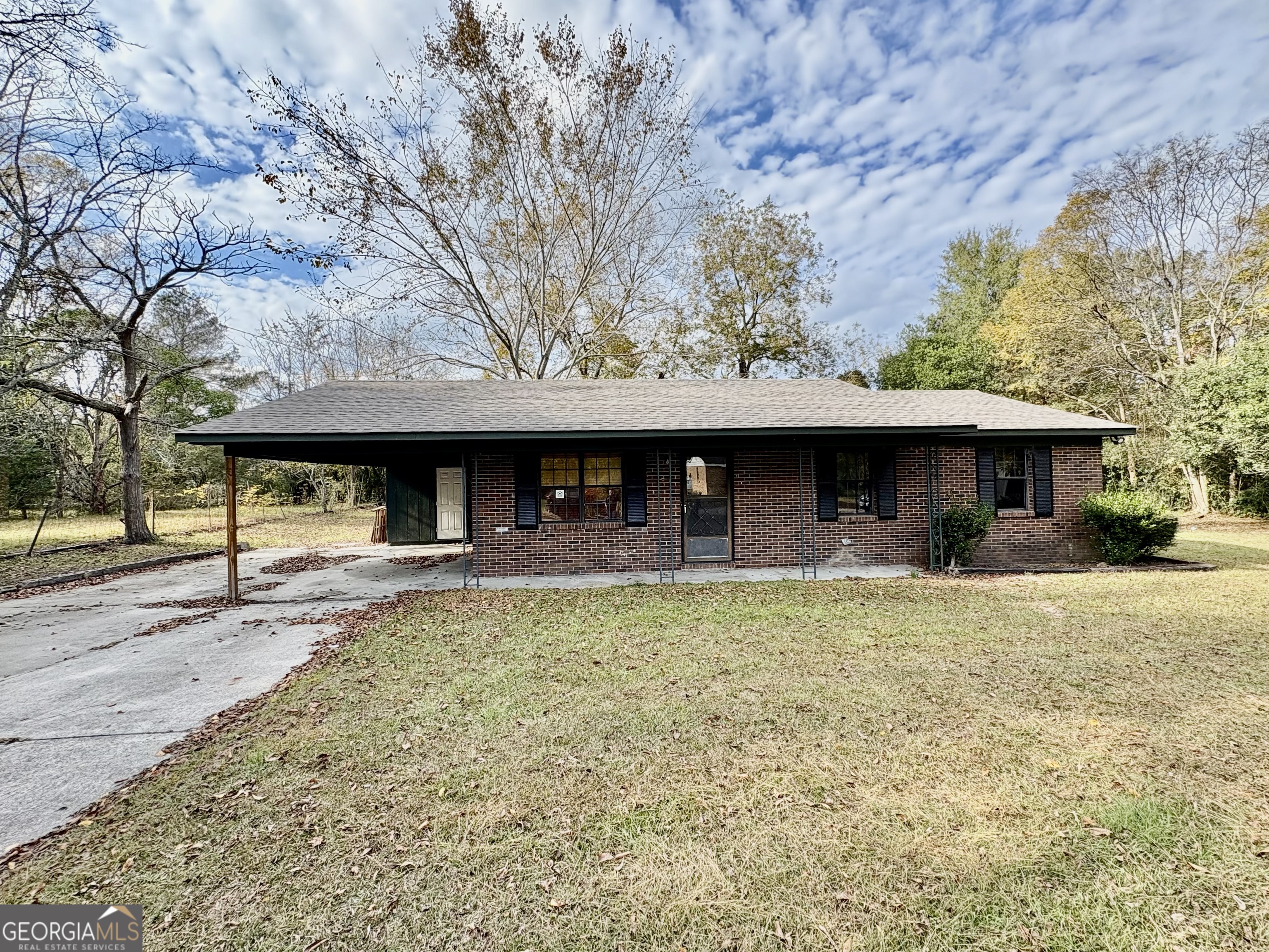 125 Marshall Street Dublin, GA 31021 - Photo 1 of 1 a view of a large tree in front of a house