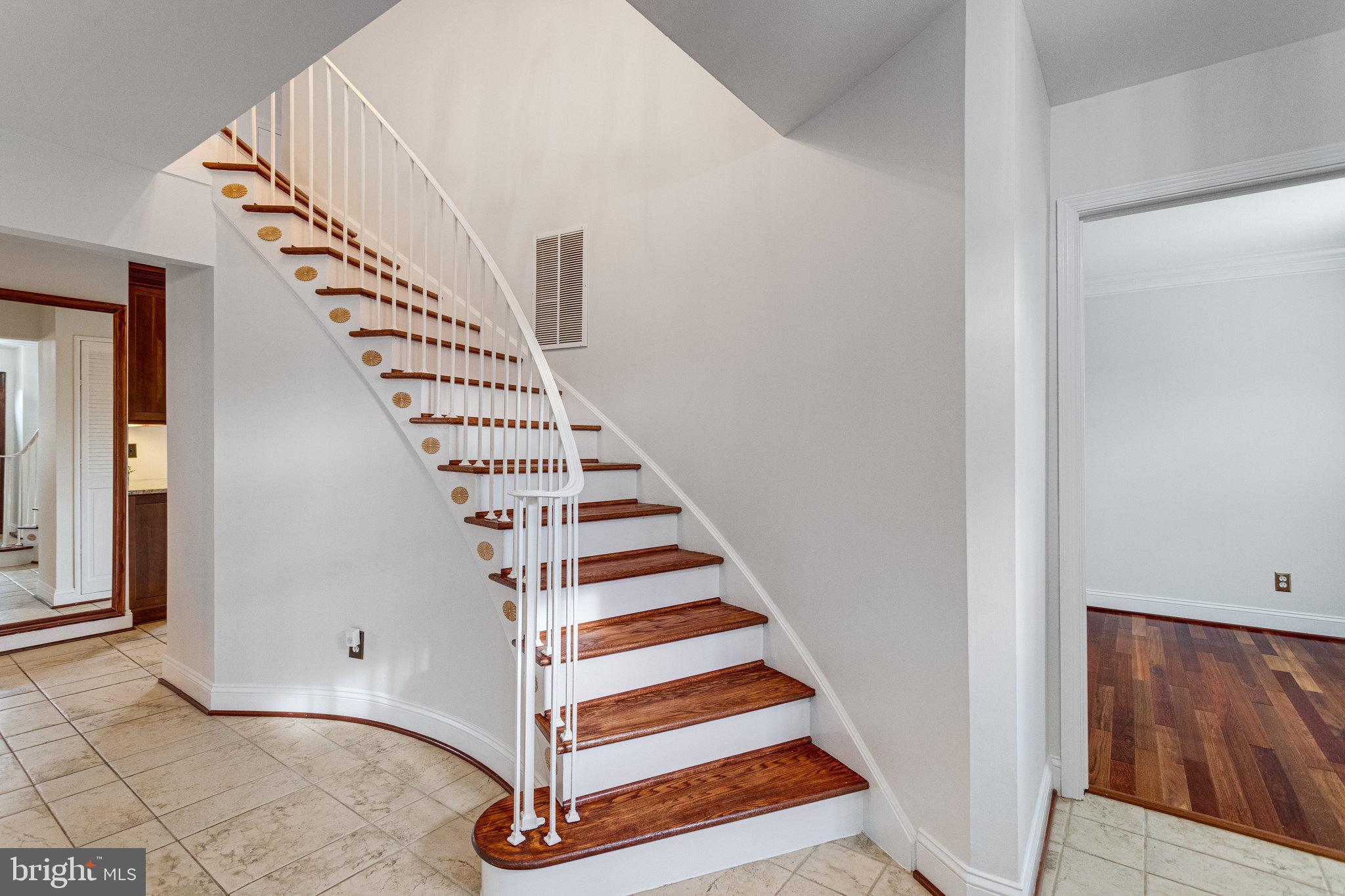 8434 Grenoble Court Springfield, VA 22152 - Photo 8 of 41 Refinished spiral staircase in foyer