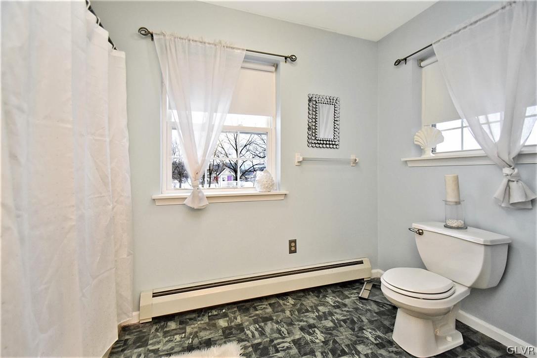 152 Meyer Road Nazareth, PA 18064 - Photo 31 of 42 a bathroom with a toilet and a shower curtain