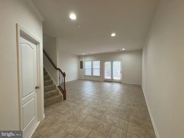 a bathroom with a shower a sink and a mirror