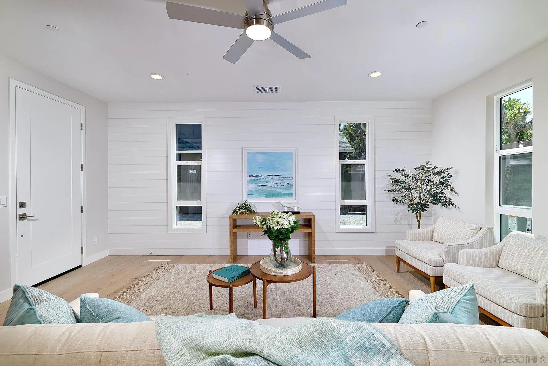 553 North Vulcan Avenue Encinitas, CA 92024 - Photo 4 of 21 a living room with furniture and a potted plant
