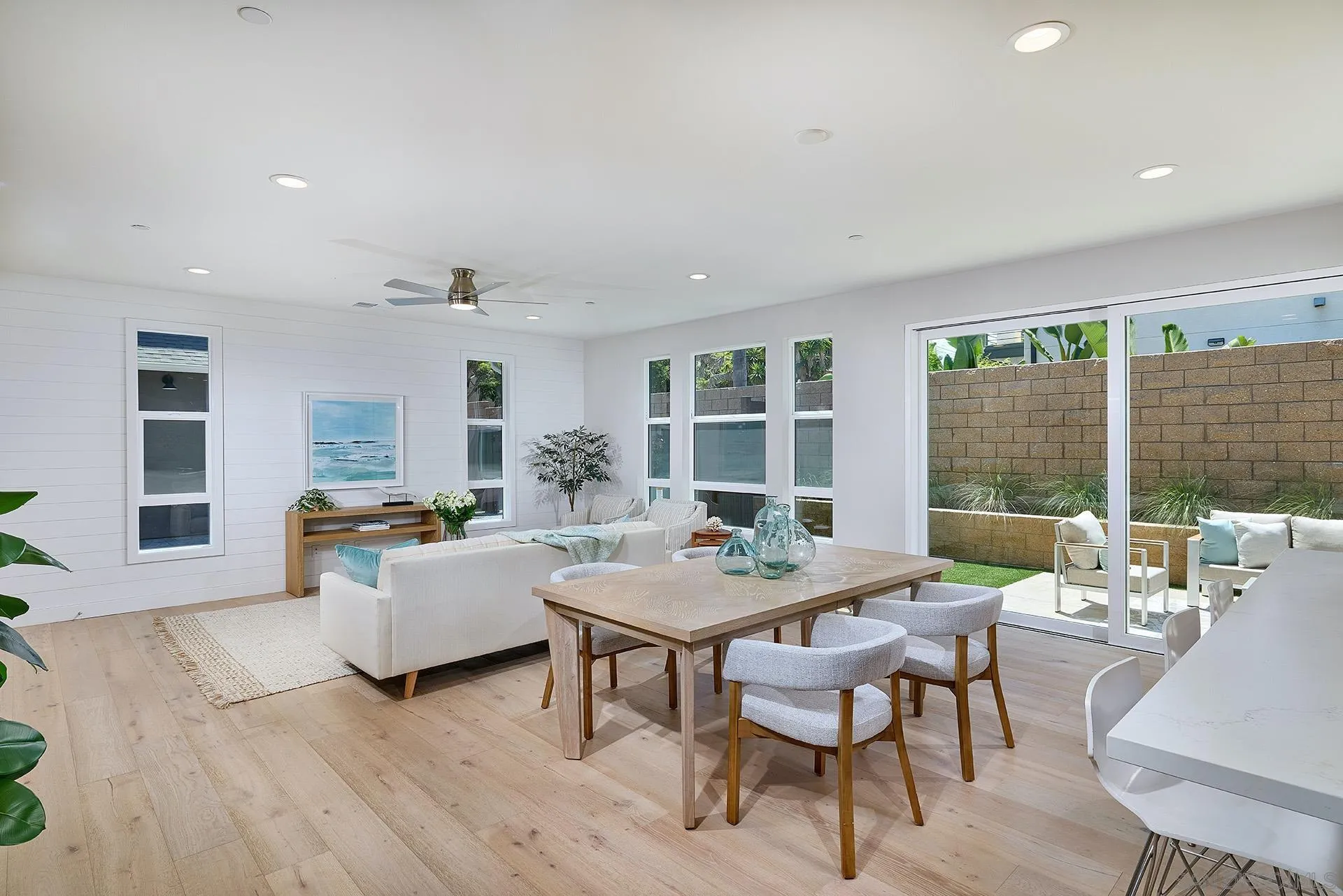 553 North Vulcan Avenue Encinitas, CA 92024 - Photo 5 of 21 a view of a dining room with furniture large windows and wooden floor