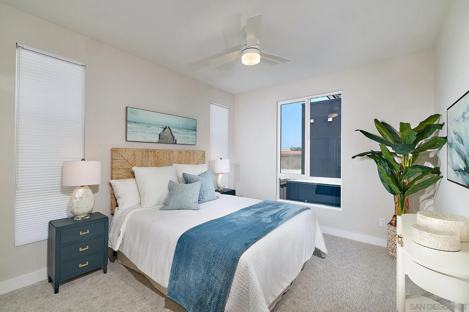 553 North Vulcan Avenue Encinitas, CA 92024 - Photo 10 of 21 a bedroom with a bed and a potted plant