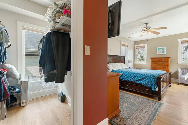 a bedroom with a bed and a chandelier