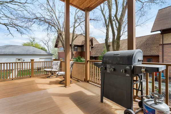 a view of a brick house with many windows