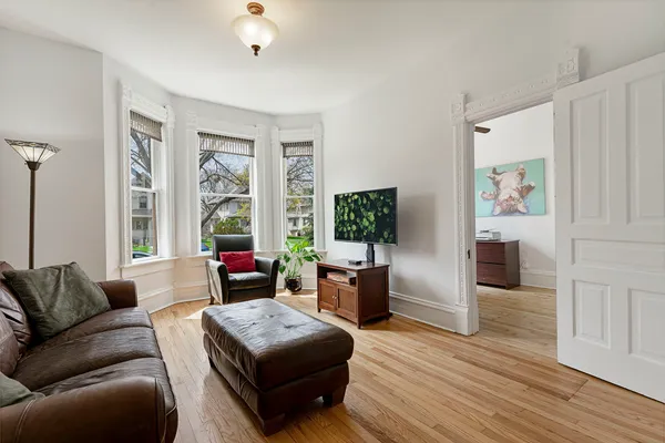 a living room with furniture and a large window