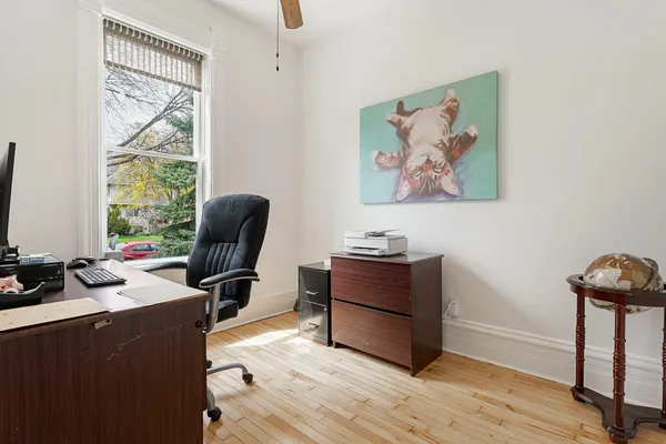 a view of workspace with wooden floor and windows