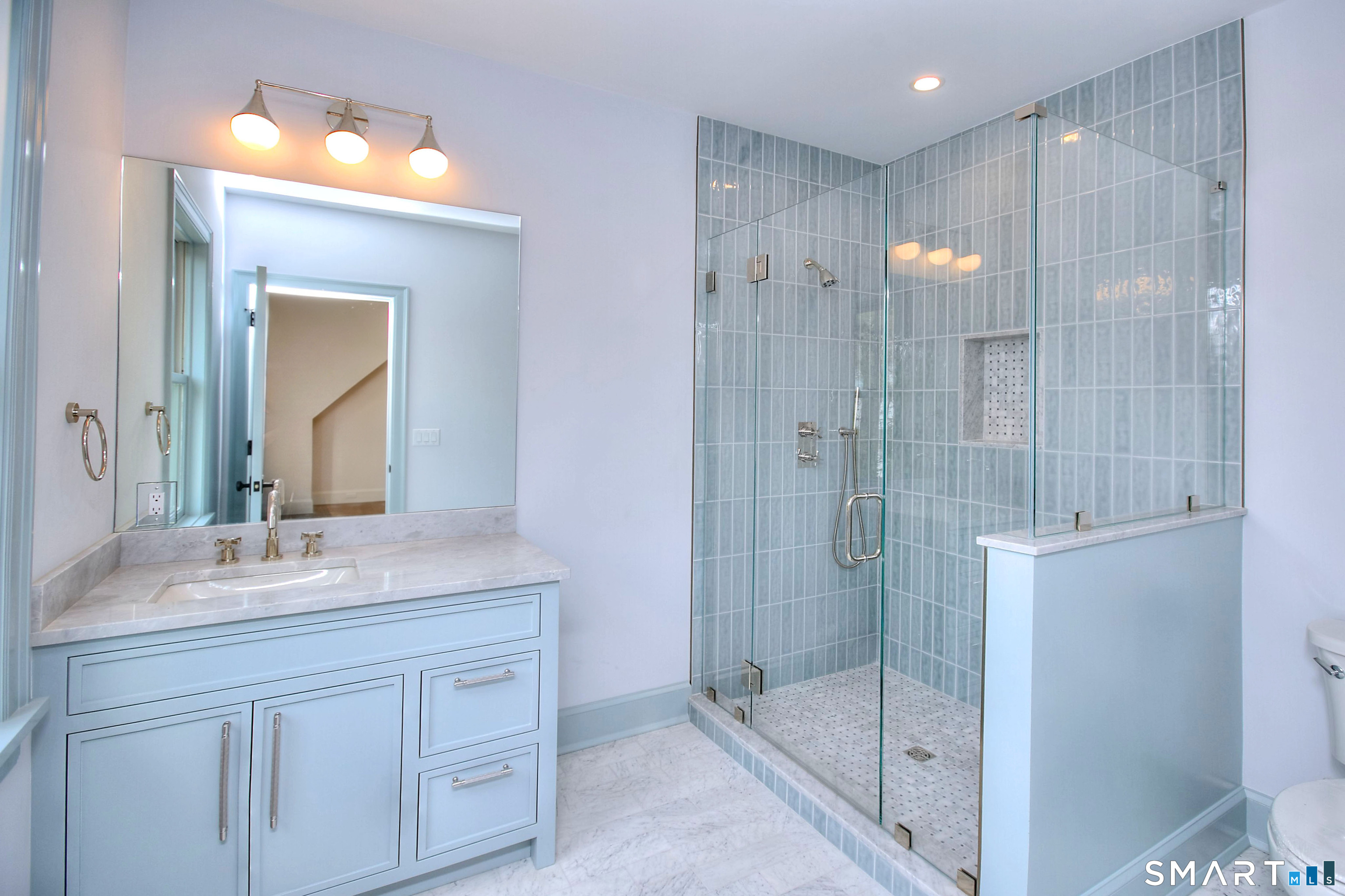 48 Kettle Creek Road Weston, CT 06883 - Photo 33 of 40 a bathroom with a shower sink and mirror