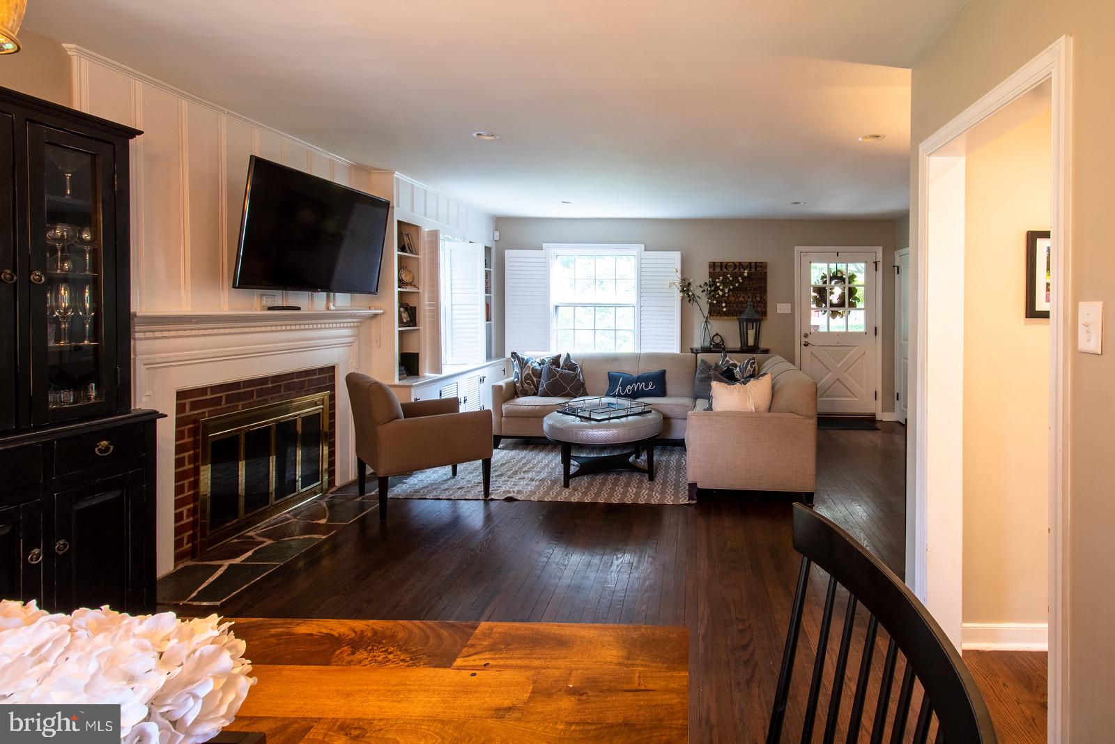 229 Rosedale Avenue Wayne, PA 19087 - Photo 6 of 25 LR w/wood burning FP & built-in bookshelves