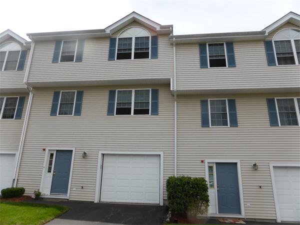 985 Trapelo Road, Unit 4 Waltham, MA 02452 - Photo 1 of 10 a front view of a house with a yard
