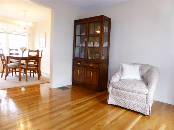 985 Trapelo Road, Unit 4 Waltham, MA 02452 - Photo 4 of 10 a living room with furniture and wooden floor