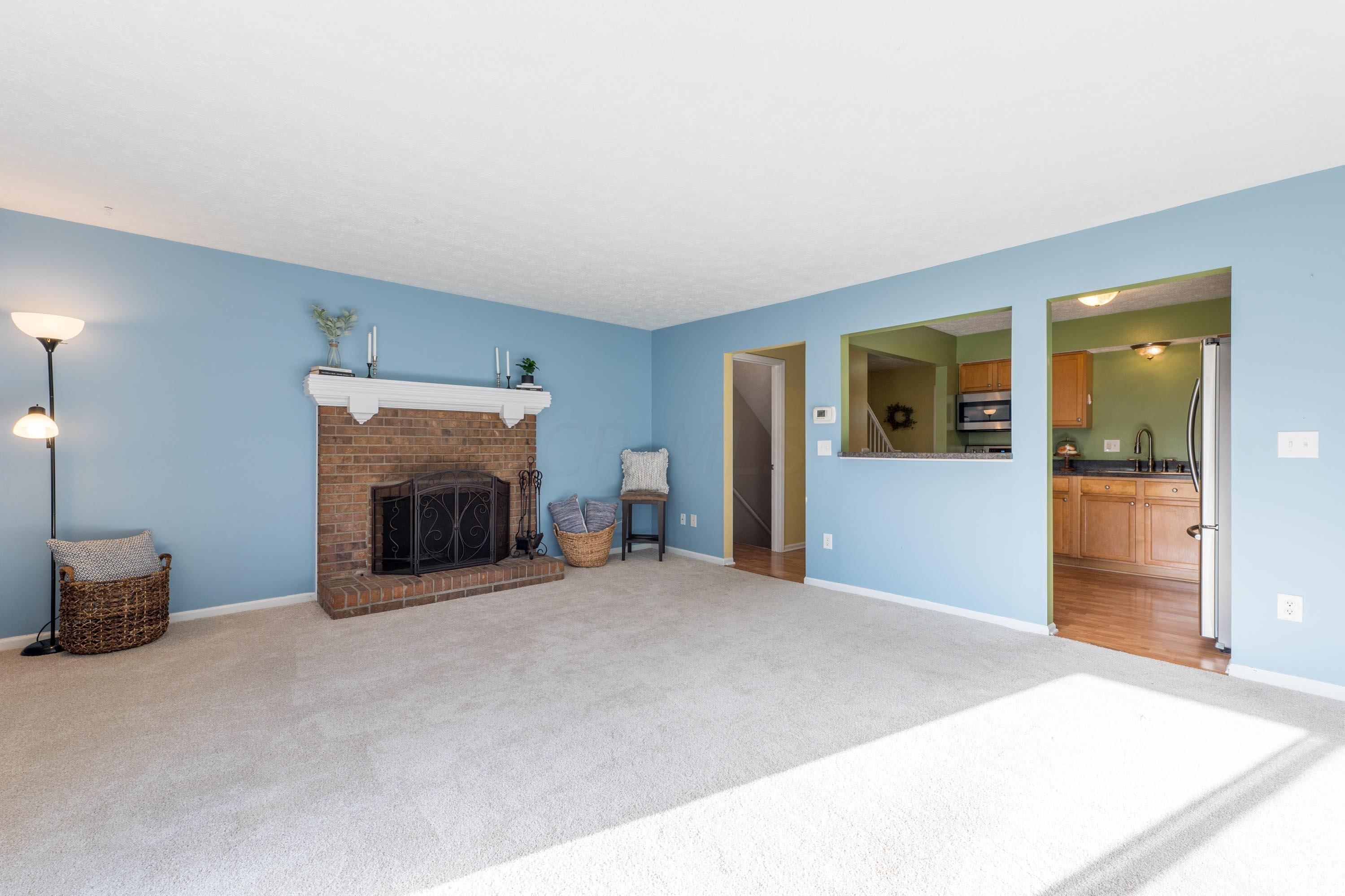 7762 Sawmill Road Dublin, OH 43016 - Photo 11 of 38 Beautiful fireplace in living room