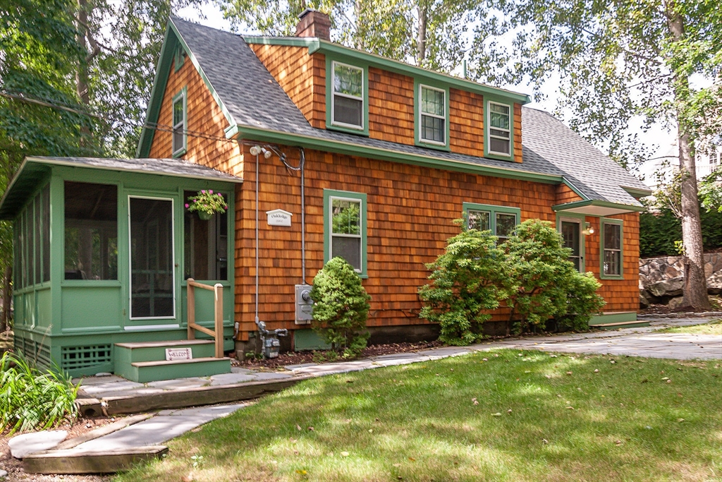 94 Atlantic Avenue, Unit 1 Cohasset, MA 02025 - Photo 1 of 23 a view of a house with backyard