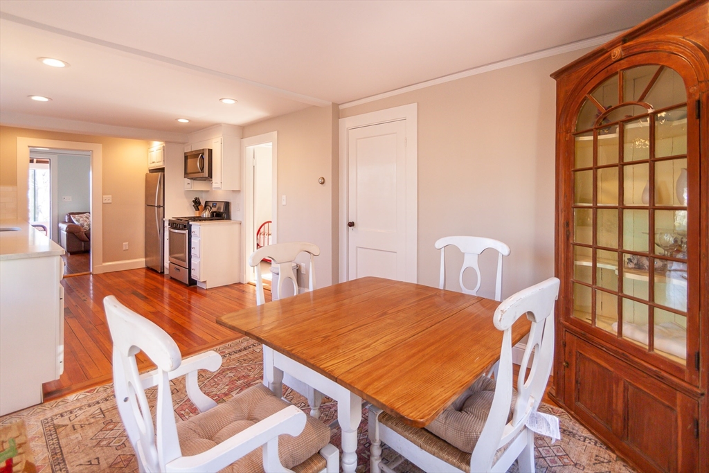94 Atlantic Avenue, Unit 1 Cohasset, MA 02025 - Photo 12 of 23 a view of a dining room with furniture window and wooden floor
