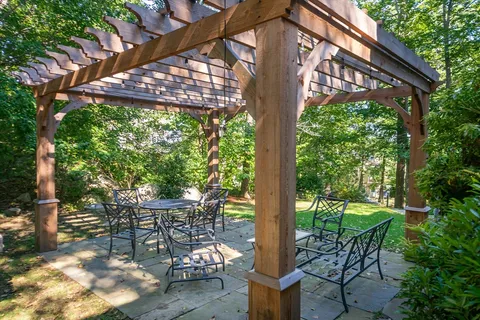 a patio with table and chairs
