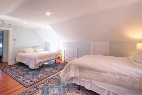 a bedroom with bed and window