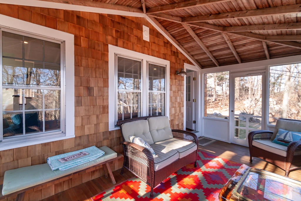 94 Atlantic Avenue, Unit 1 Cohasset, MA 02025 - Photo 5 of 23 a living room with furniture and a large window