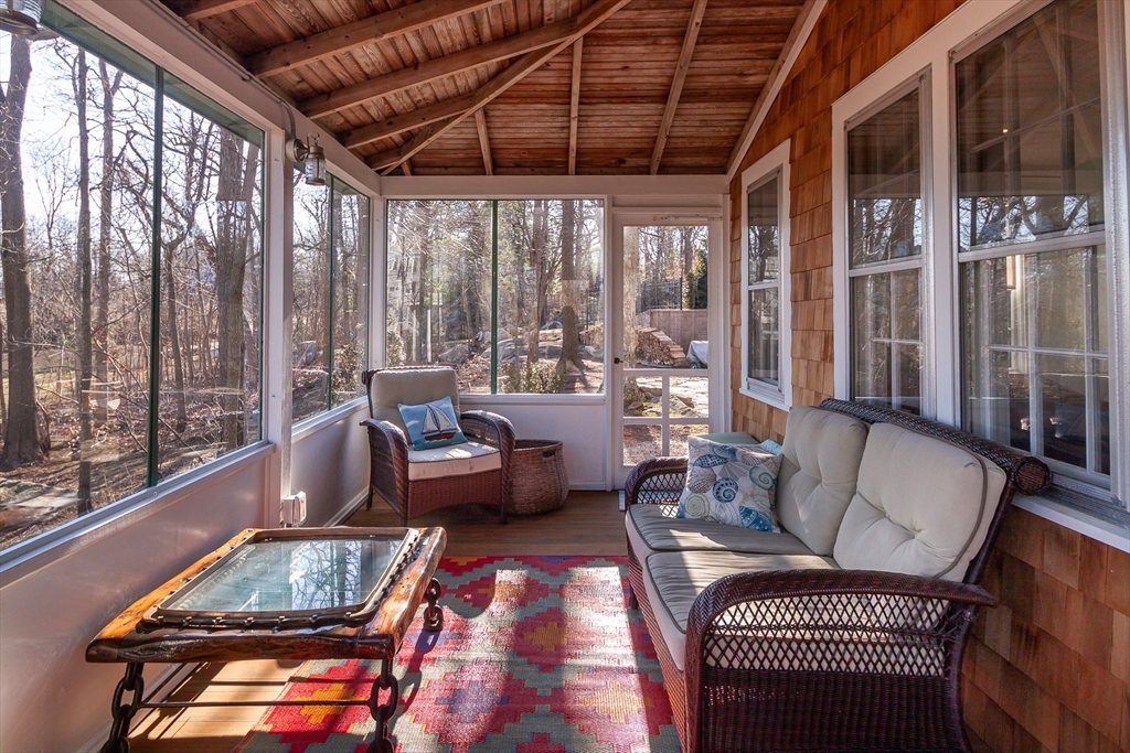 94 Atlantic Avenue, Unit 1 Cohasset, MA 02025 - Photo 6 of 23 a living room with furniture and a floor to ceiling window