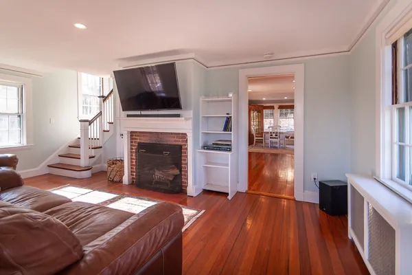 a living room with furniture fireplace and flat screen tv