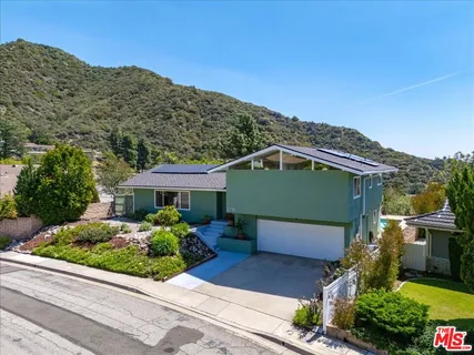 a house view with a garden space