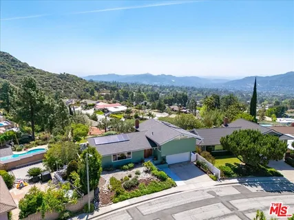 an aerial view of residential house and outdoor space