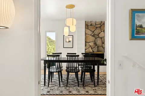 view of a dining room with furniture and wooden floor