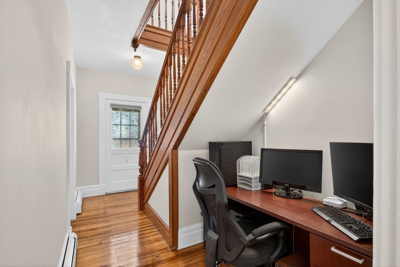 420 West Spring Street Woodstock, VA 22664 - Photo 10 of 67 a view of a workspace with furniture and stairs
