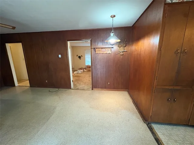 wooden floor in an empty room with a mirror