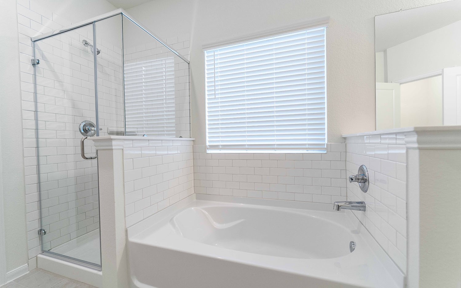 10604 Altitude Way Conroe, TX 77303 - Photo 12 of 33 a bathroom with a shower and a bathtub