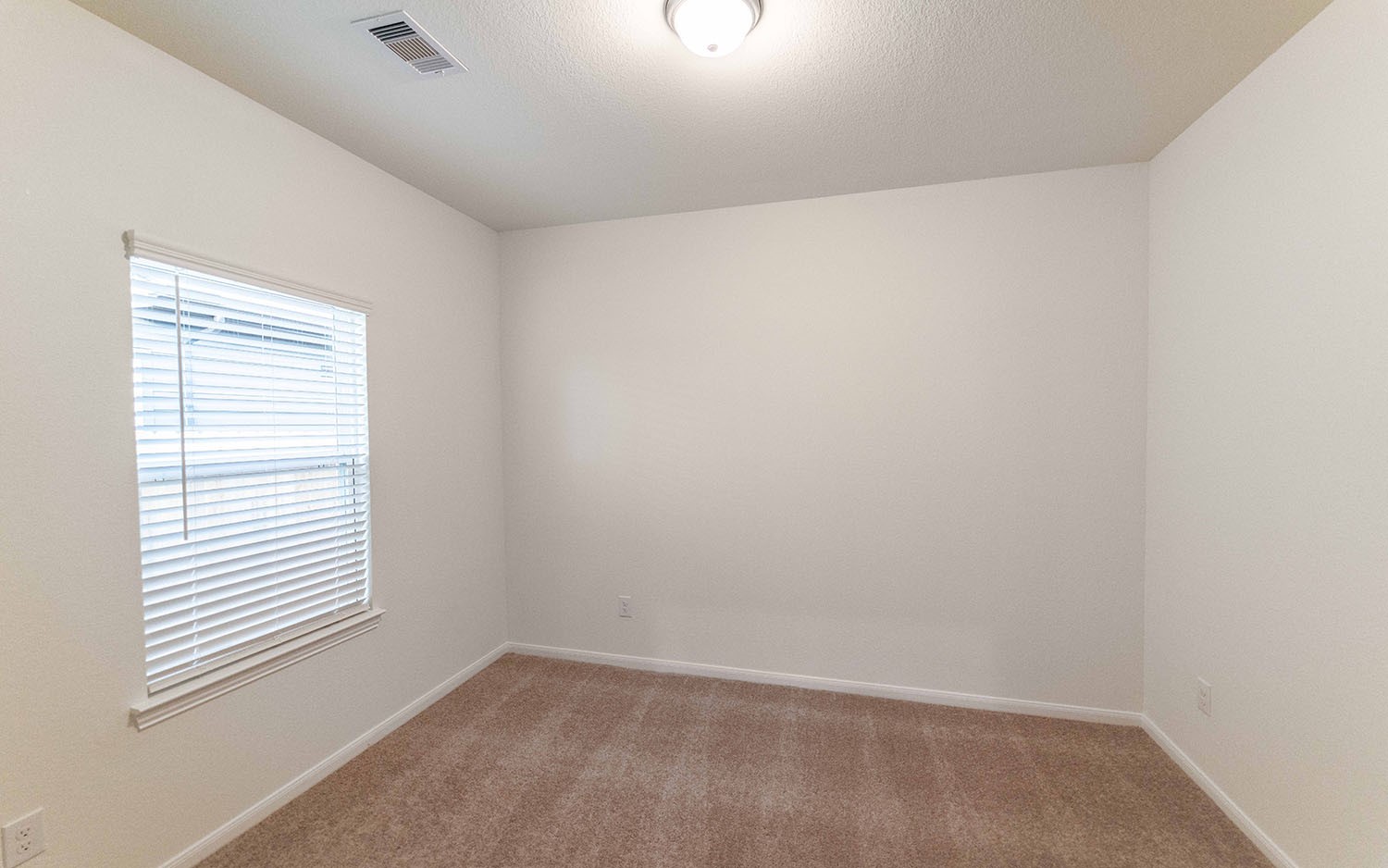 10604 Altitude Way Conroe, TX 77303 - Photo 15 of 33 an empty room with a window