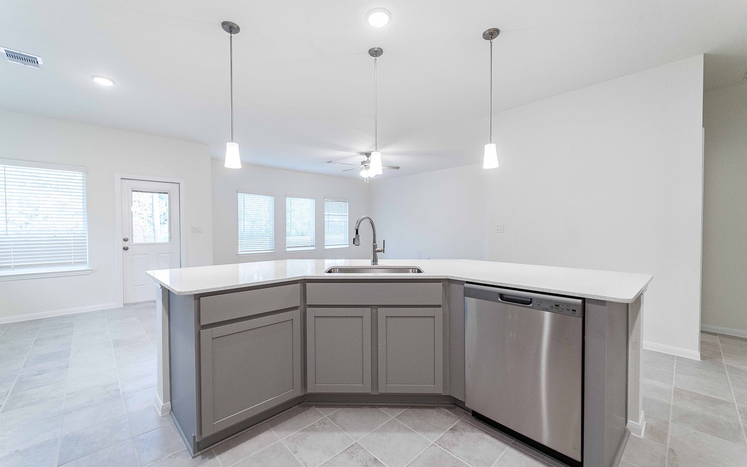 10604 Altitude Way Conroe, TX 77303 - Photo 6 of 33 a kitchen with sink stove and cabinets