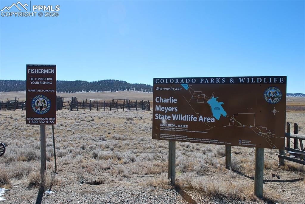 1198 Chase Gulch Road Hartsel, CO 80449 - Photo 14 of 16 a view of a bench sitting in backyard