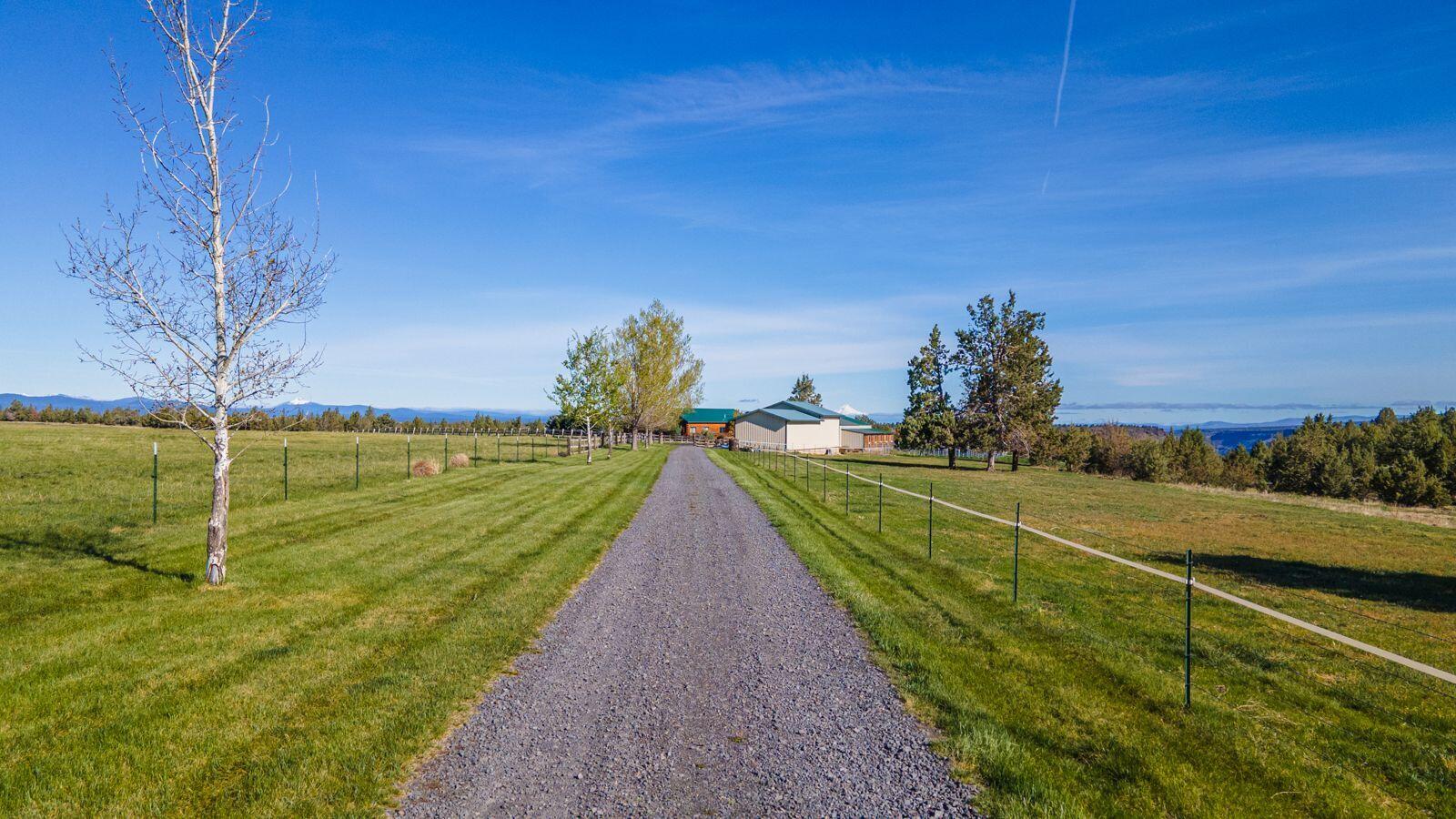 10000 Southwest Lyons Drive Culver, OR 97734 - Photo 16 of 90 a view of a lake with a big yard