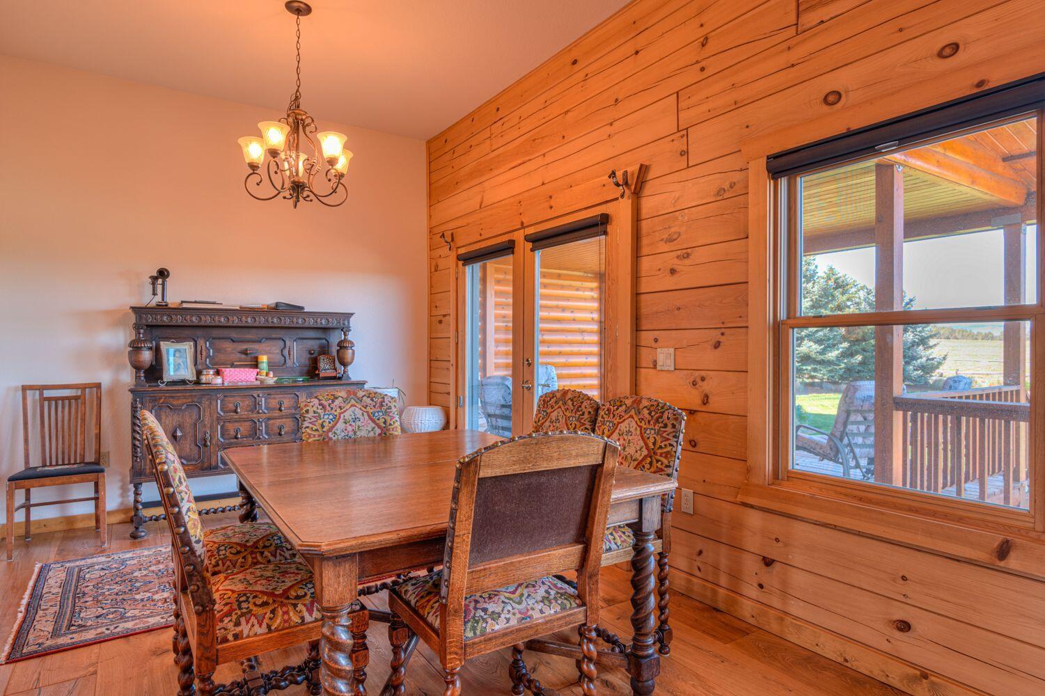 10000 Southwest Lyons Drive Culver, OR 97734 - Photo 25 of 90 a view of a dining room with furniture a chandelier and wooden floor