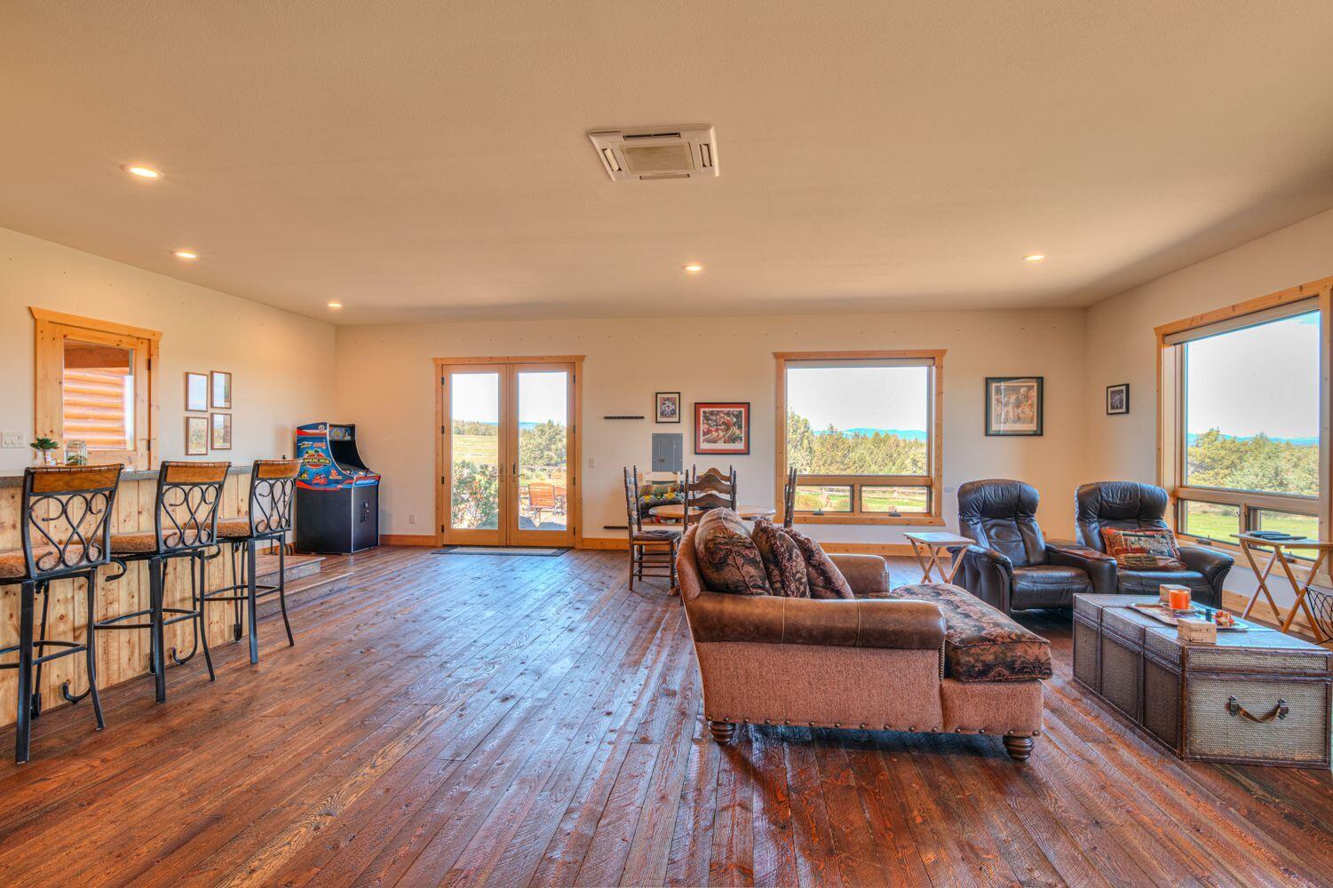 10000 Southwest Lyons Drive Culver, OR 97734 - Photo 39 of 90 a living room with furniture and a wooden floor