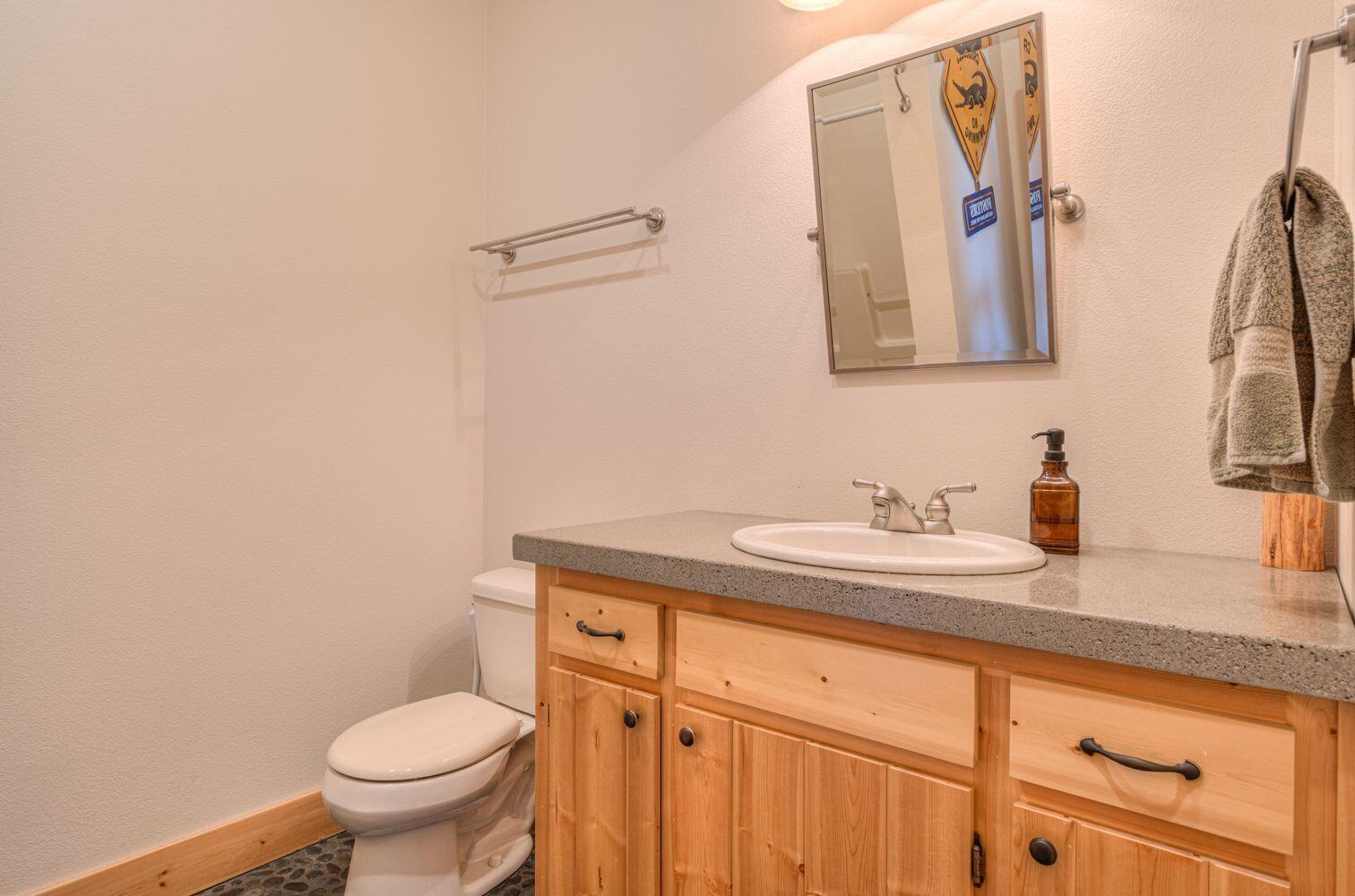 10000 Southwest Lyons Drive Culver, OR 97734 - Photo 43 of 90 a bathroom with a granite countertop sink and a toilet